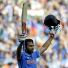 India's Rohit Sharma celebrates reaching his century against Bangladesh in Melbourne. REUTERS...