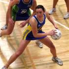 Otago goal shoot Grier Campbell eyes the hoop as Auckland Waitakere goal keep Kate Dowling looms...