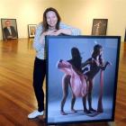 Photographer Yvonne Todd with images from her exhibition "Wall of Seahorsel" at Dunedin Public...