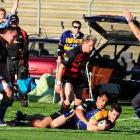 Referee Glen Jackson awards Otago wing Joe Hill a try as he crosses the line in the tackle of...