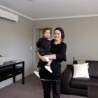 Tessa Williams, who is pregnant with her second child, and son Romie Chapman inspect their new...