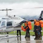 The Floppy Jims get ready to load up the helicopter in preparation for a 56-hour search exercise....