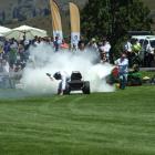 ''The Stig'' and his lawn mower are doused with a fire extinguisher after  an explosive finish in...