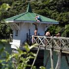 A 13-year-old boy climbs on the roof of the valve tower at Ross Creek Reservoir yesterday. Photo...