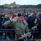 A bagpiper from the Australian army salutes during a dawn ceremony marking the 100th anniversary...