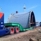 A ball mill shell arrives by ferry at Port Irene on Luzon island in the Philippines for transport...