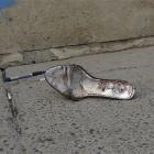 A bloody shoe lies at the scene of a car bomb attack in front of a Syrian Catholic Church, in...