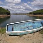 A boat is seen out of water on the dam reservoir of Santa Clara a Velha in southern Portugal....