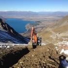 A BWC Ltd machine digs the 900m of 1.5m deep trench for Ohau Snow Fields' snow-making system...