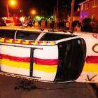 A car lies overturned in Castle St on Friday. Photo by Craig Baxter
