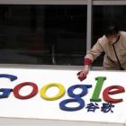 A Chinese worker cleans the Google logo at the Google China headquarters in Beijing, China.  (AP...