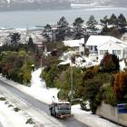 A contractor clears snow on Stuart St, in Dunedin. Photo by Linda Robertson.