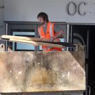 A contractor fills a skip with material from the former Hoyts cinema in Dunedin yesterday. Photo...