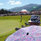 A crowd watches Tag Ridings (US) putt on the 15th (Party Hole) green on The Hills course. Photo...