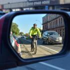 A cyclist makes his way along Cumberland St, Dunedin, in a cycle lane.