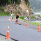 A cyclist negotiates a section of the Otago Peninsula cycleway under construction on Portobello...