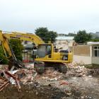 A digger at Dunedin's Bayfield High School, where the archway and front entrance have been...