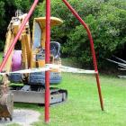 A digger sits cordoned off after it was taken was taken for a short joyride in the Dunedin Town...