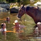 A dip in the Taieri River proves soothing for Annette O'Callaghan (Hindon), Casey Boland ...