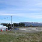 A drag-racing "rail" takes off on the Alexandra airport runway at the Pro Active Thunder Sunday...