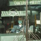 A Dunedin Passenger Transport driver wears a surgical mask during a bus journey in Princes St...