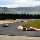 A Ferrari GT corners during practice at corner No 8 at the Highlands Motorsport Park Highlands...