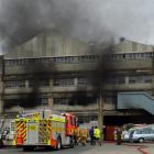 A fire appliance and firefighters at a blaze in the former Burnside freezing works, Kaikorai...