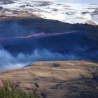 A fire burns through tussock on the hills above Fruitlands, south of Alexandra, yesterday...