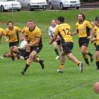 A first five-eighth Chris Jones runs a backline move in the game against  Wakatipu Wanderers at...