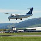 A flight lands at Dunedin Airport. Photo by ODT.