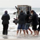 A German-led film crew films Elisabeth Lanz (far left), playing marine biologist Julia, for a...