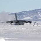 A huge C17 Globemaster 111 lands at Pegasus Airfield, near McMurdo Sound, in the Antarctic.