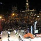 A huge crowd of spectators watches the freestyle antics of skiers and snowboarders at the Octagon...