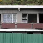 A Kaikorai Valley Rd unit (right) was extensively damaged by heat and smoke in a suspicious fire....