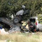 A Land Rover Discovery and trailer at the crash site. The upturned trailer was carrying a large...