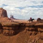 A lone Western rider at John Ford's Point on the Utah/Arizona border, USA. Photo by Luca Galuzzi.