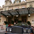 A luxury car is parked outside the Monaco casino in Monte Carlo, a playground for the world's...