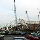 A main roof truss is hoisted into place at Forsyth Barr Stadium, in Dunedin, yesterday. Photo by...