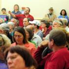 A member of the crowd argues against the stadium project. Photo by Craig Baxter.