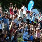 A Mexican wave goes around the crowd during the 2009 final. Photos by Craig Baxter and Tracey...