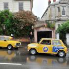 A Mini drives past the garage in Royal Tce, in Dunedin, where some of the Goodbye Pork Pie movie...