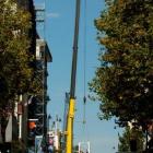 A mobile crane is used to assemble a construction crane at Otago House in Princes St, Dunedin,...