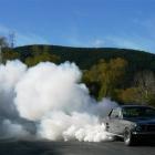 A Mustang creates a plume of smoke at the Lawrence quarter-mile sprints last year. Photo by Kim...