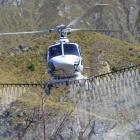 A Nokomai Helicopters aircraft uses American drift reduction nozzles when spraying herbicide on...