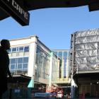 A pedestrian gets a first look at Dunedin's Wall St shopping mall development in George St, now...