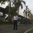 A security guard stands near a damaged Chinese-owned shoe factory in Vietnam's southern Binh...