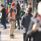 A skateboarder makes his way down George St, in Dunedin. Photo by Craig Baxter.