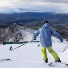 A skier takes to the Coronet Peak slopes.  Photo by Brandon Stanley.