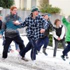 A snow attack is unleashed in Highgate, Dunedin, yesterday. Photo by Stephen Jaquiery/Craig Baxter.
