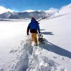 A snowboarder hikes in the new snow at the Remarkables. Photo by Wendy van Dijk.